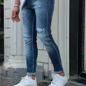 Jean slim fit bleu vintage à déchirures renforcées – Homme